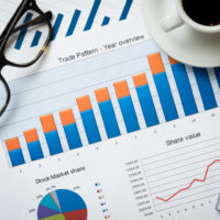 Close up of business document on office desk. Top view of business charts and graphs of stock market. Closeup of growing financial chart.